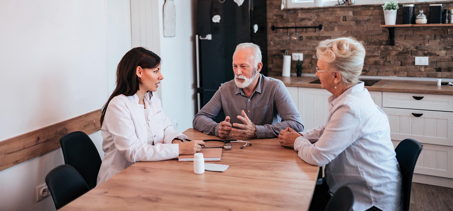 Skilled nurse providing home health care to senior patient