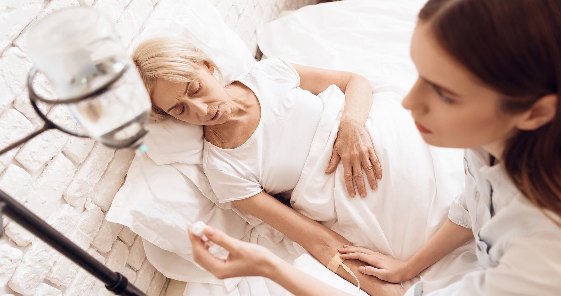 Care team providing palliative support to patient and family