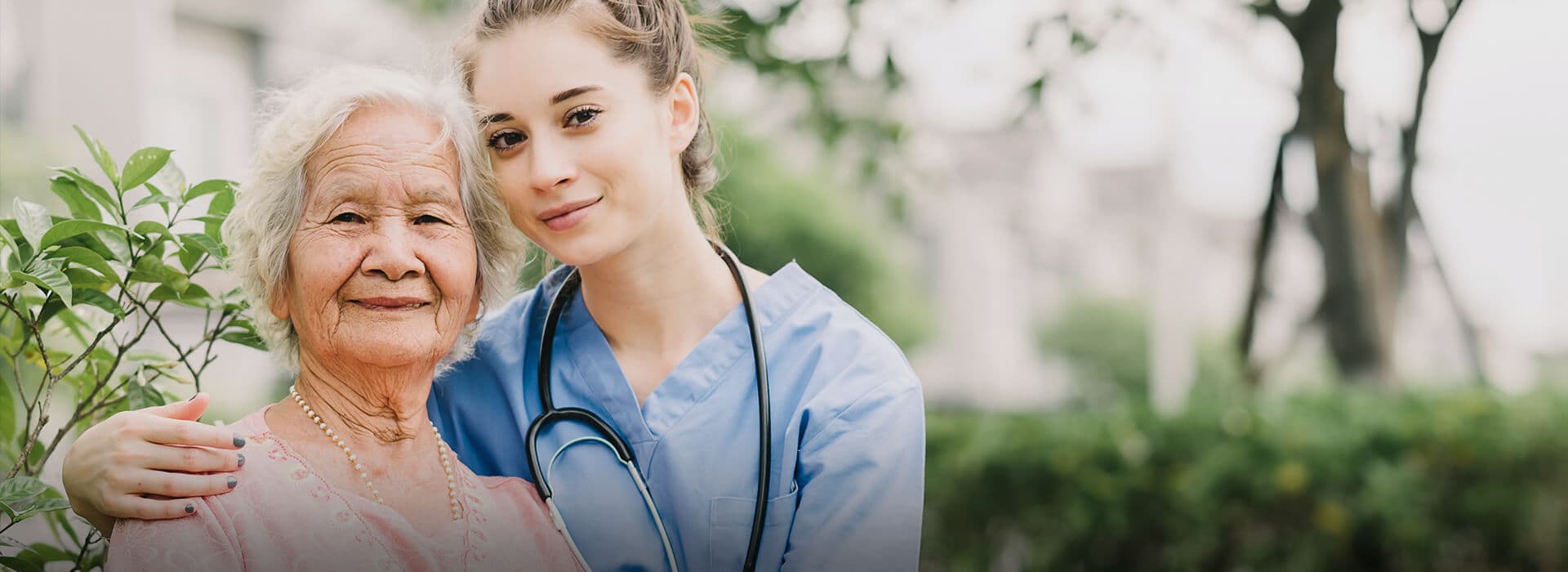 Compassionate nurse caring for an elderly patient at home